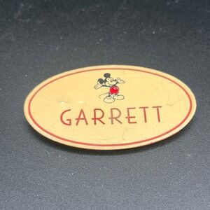 A Disneyland cast member name tag "Garrett" Mickey Mouse 1989. 2.5"x1.5"
